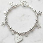 Silver beaded bracelet with flower charms