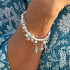 Silver beaded bracelet with flower charms