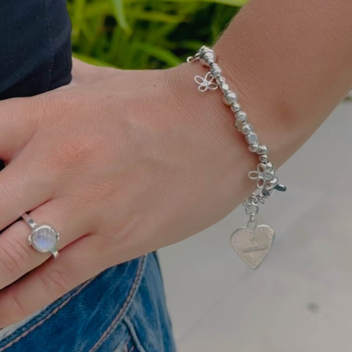 Silver beaded bracelet with flower charms